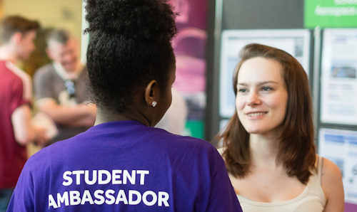 Prospective student talking to student ambassador on an open day